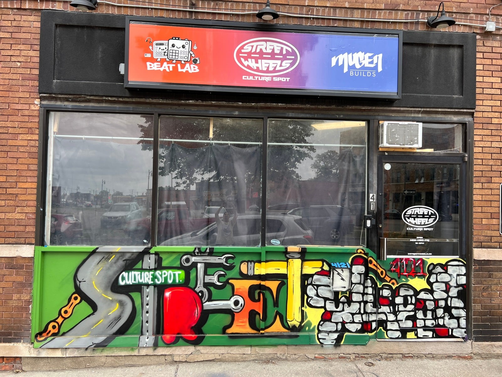 Street Wheels Culture Spot storefront and graffiti mural at 4121 Cicotte St, shared with Beat Lab and Mugen Builds